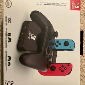 Nintendo Switch Charging Dock with Black, Red, and Blue Controllers